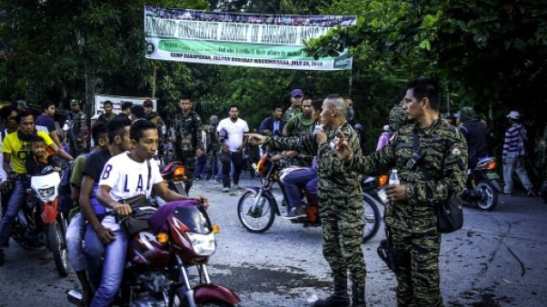 Paix dans le sud des Philippines: les rebelles musulmans consultent leur base Paix dans le sud des Philippines: les rebelles musulmans consultent leur base