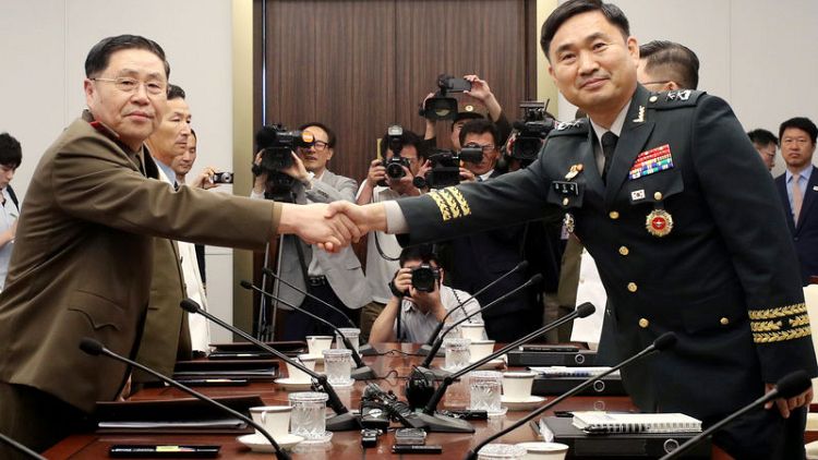 Two Koreas discuss reducing military tension amid reports of North Korea missile activity