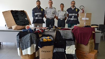 Gdf Bolzano dona 1000 capi confiscati Gdf Bolzano dona 1000 capi confiscati