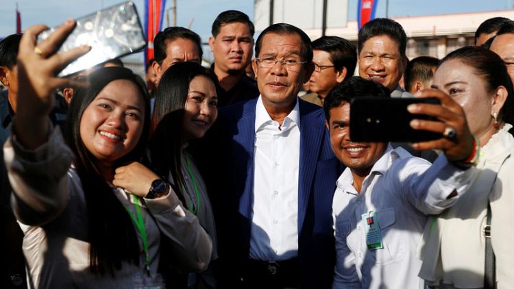 Cambodia's Hun Sen takes selfies in first appearance since controversial election