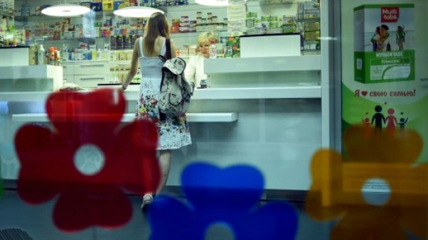 Une cliente dans une pharmacie à Minsk, le 29 juillet 2018 au Bélarus Une cliente dans une pharmacie à Minsk, le 29 juillet 2018 au Bélarus