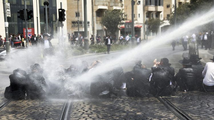 Ultra-Orthodox Jews protest Israeli draft, scuffle with police
