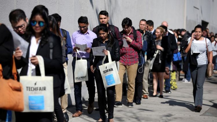 U.S. jobless claims rise modestly, labour market firming