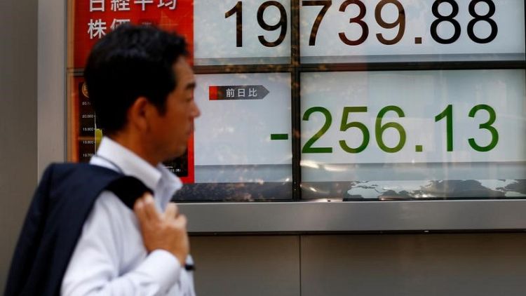 Asia stocks restrained, dollar at two-week high as trade war saps confidence