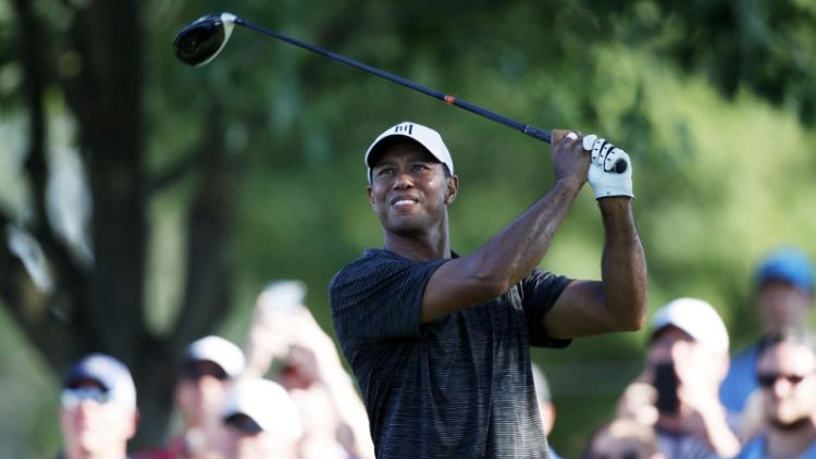 Woods and McIlroy toil but finish within striking distance
