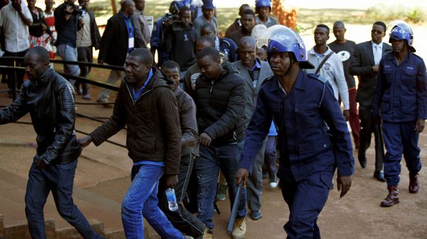 Zimbabwe opposition members in court over post-election violence, victims buried Zimbabwe opposition members in court over post-election violence, victims buried