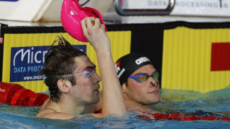 Swimming: Teenager Kolesnikov achieves remarkable 'double-double'
