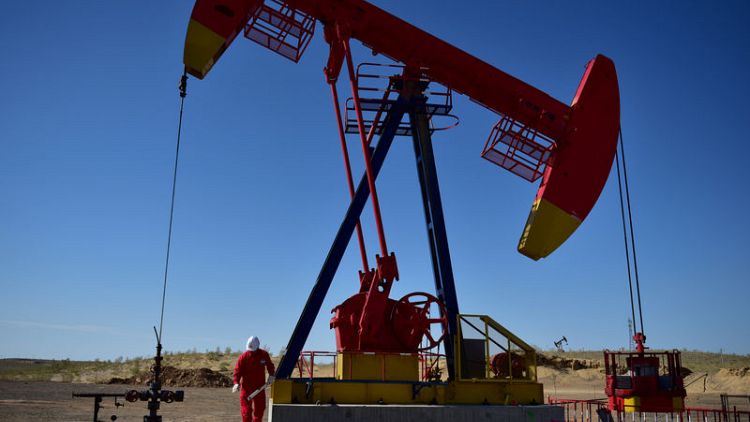 Oil prices rebound slightly after heavy declines over trade dispute