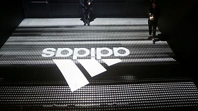 Adidas takes Reebok impairment, sticks to 2018 outlook