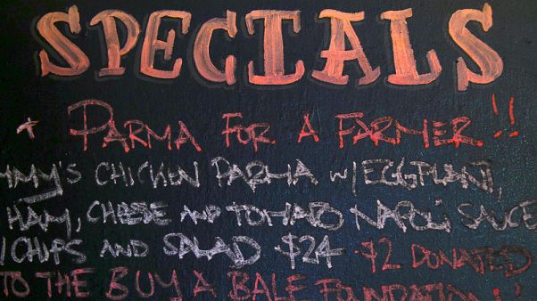 Australians eat 'parma' for drought-stricken farmers Australians eat 'parma' for drought-stricken farmers