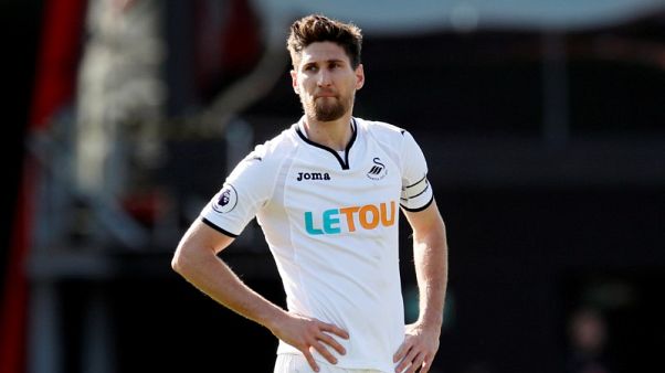 Defender Fernandez swaps Swansea for Newcastle Defender Fernandez swaps Swansea for Newcastle