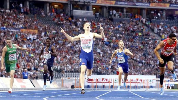 Athletics - Warholm wins first leg of audacious one-lap double Athletics - Warholm wins first leg of audacious one-lap double