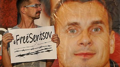 Macron says he discussed hunger striker Sentsov with Putin