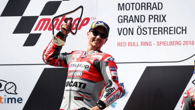 Lorenzo staves off Marquez challenge to win Austrian GP