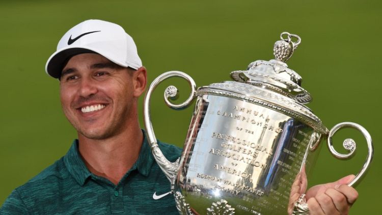 Koepka holds off Woods to win PGA Championship