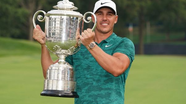 Koepka wins PGA Championship by two strokes from Woods Koepka wins PGA Championship by two strokes from Woods