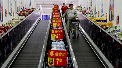 China's economy cools further, investment growth at record low