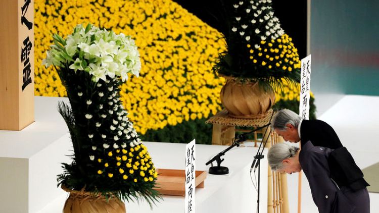 Japan emperor expresses 'deep remorse' over war; PM sends offering to shrine
