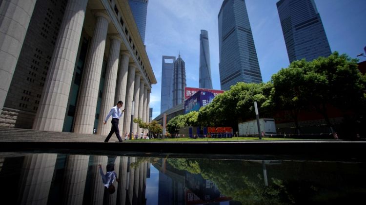 China vows to control debt despite fresh stimulus for cooling economy