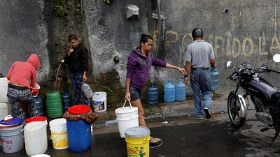 Hospitals scrap surgeries, Venezuelans forgo showers as taps run dry