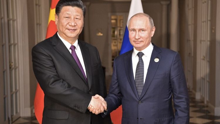 Putin says China's Xi to visit Russia in Sept. - agencies