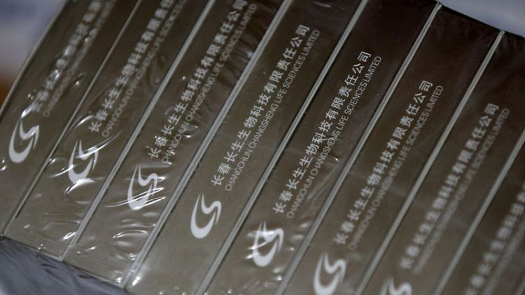 China sacks top official over vaccine scandal, firm may de-list