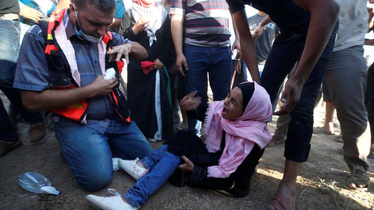 Israeli troops kill two Palestinians in Gaza border protests - medics
