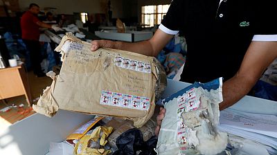 Eight years late, Palestinian mail arrives in West Bank