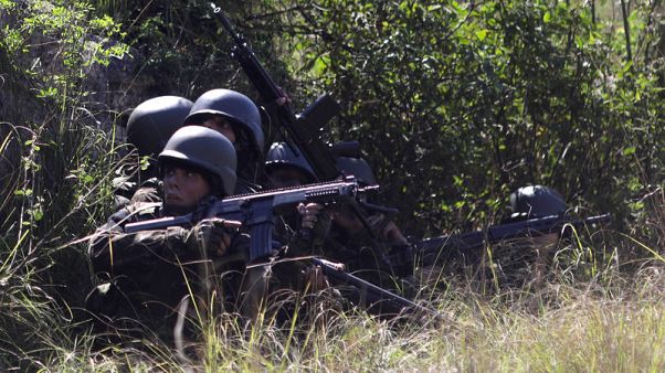 Twelve dead as Brazilian soldiers, police swarm Rio slums in anti-drug assaults Twelve dead as Brazilian soldiers, police swarm Rio slums in anti-drug assaults