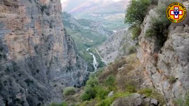 Helicopters, rescuers scour creek bed after Italy flash flood kills 10 Helicopters, rescuers scour creek bed after Italy flash flood kills 10