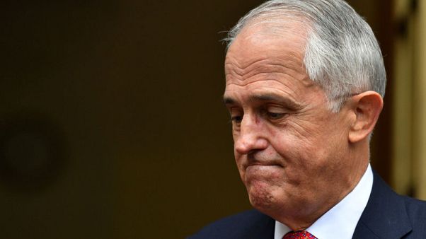 Australian PM, fighting for political life, dumps tax policy Australian PM, fighting for political life, dumps tax policy