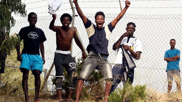 More than 100 migrants storm border of North African Spanish enclave More than 100 migrants storm border of North African Spanish enclave