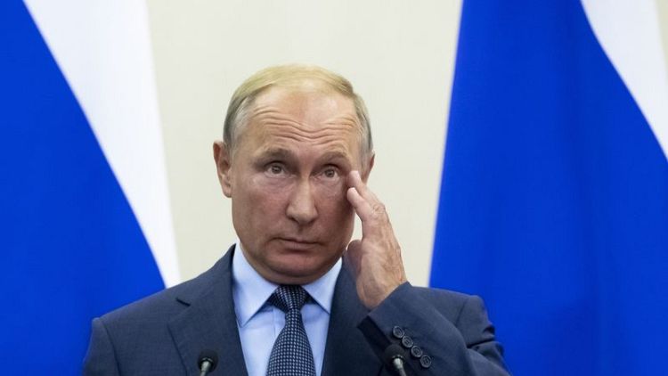 Putin deplores U.S. sanctions, but lauds Trump meeting