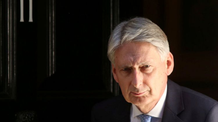 Conservatives split again by Hammond's Brexit warning