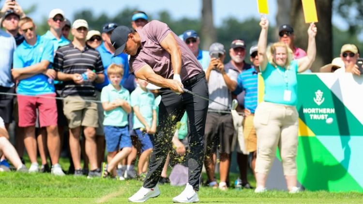 Koepka's late blitz catches Lovemark as Woods barely makes cut