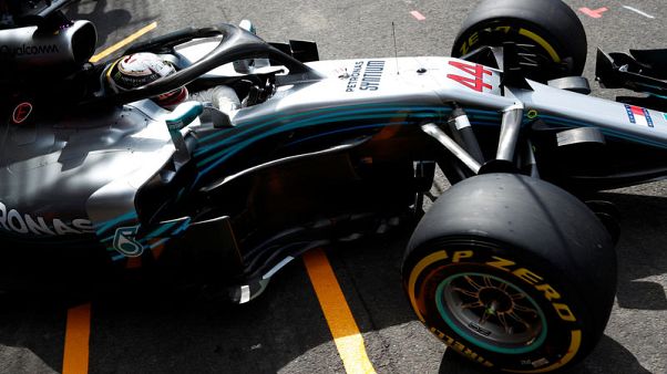 Hamilton on pole after rain shakes up Belgian grid Hamilton on pole after rain shakes up Belgian grid