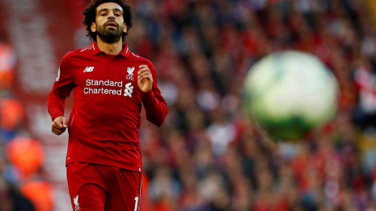 Salah strike sinks Brighton and sends Liverpool top