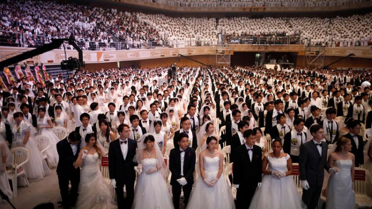 New generations sustain South Korean church’s mass weddings
