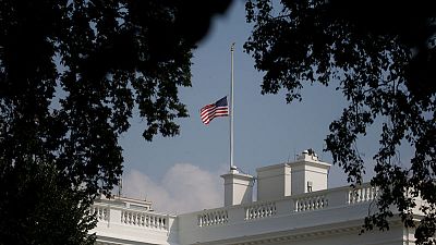 White House wobbles on U.S. flag after McCain death