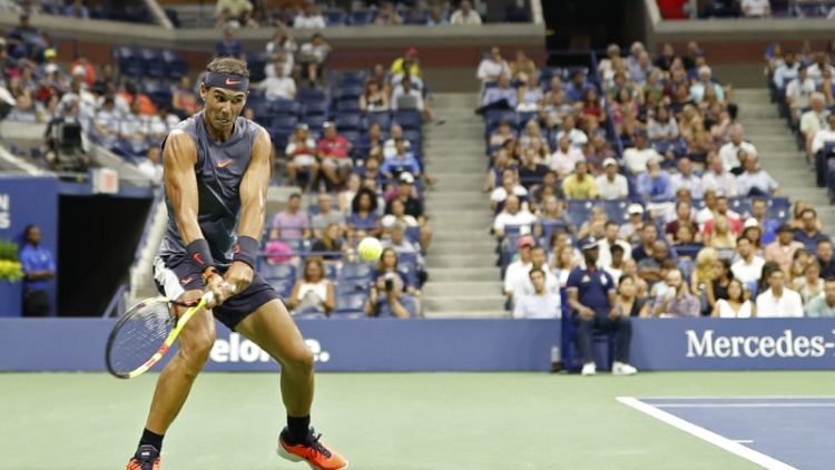 Nadal through to round two after Ferrer retires