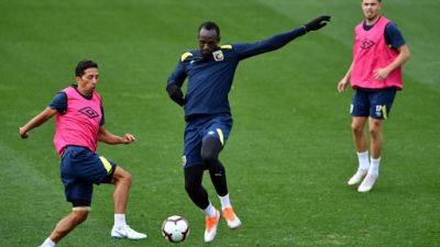 Australie: Bolt travaille dur pour s'adapter au rythme du football pro
