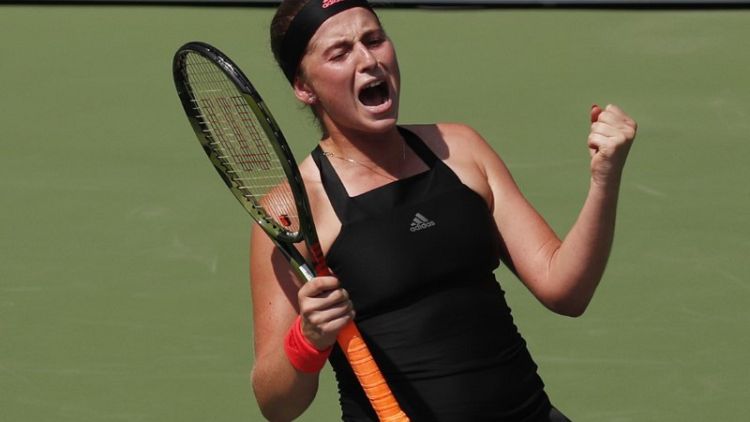 Ostapenko sweats out win as heat turned up at U.S. Open