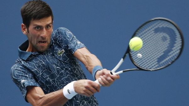 Djokovic battles through brutal heat to topple Fucsovics Djokovic battles through brutal heat to topple Fucsovics