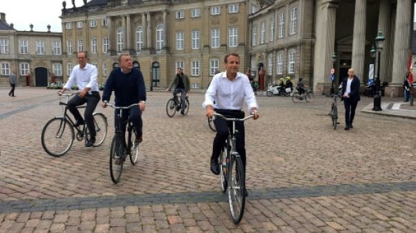 Le Tour de France partira bientôt du Danemark, assure Macron, à vélo dans Copenhague Le Tour de France partira bientôt du Danemark, assure Macron, à vélo dans Copenhague
