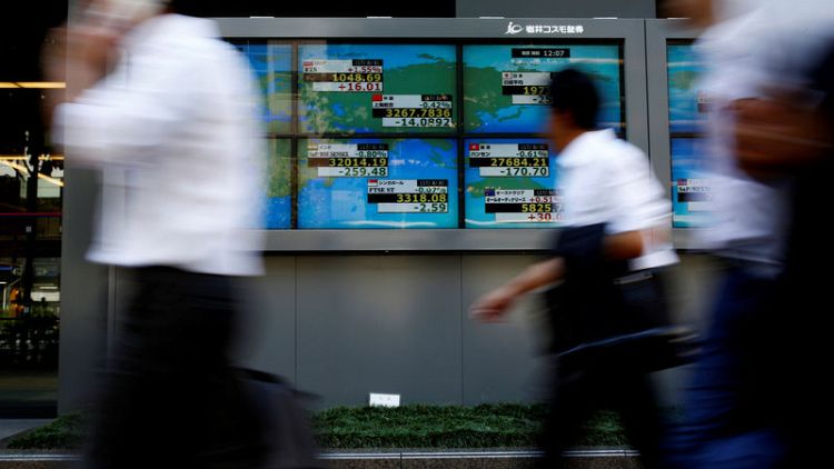 Asian stocks dip on trade, emerging market woes