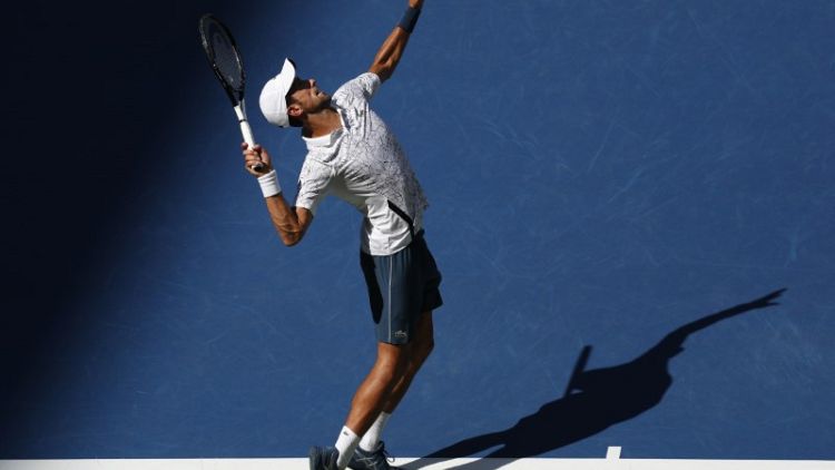 Djokovic beats heat and Sousa to reach U.S. Open quarters