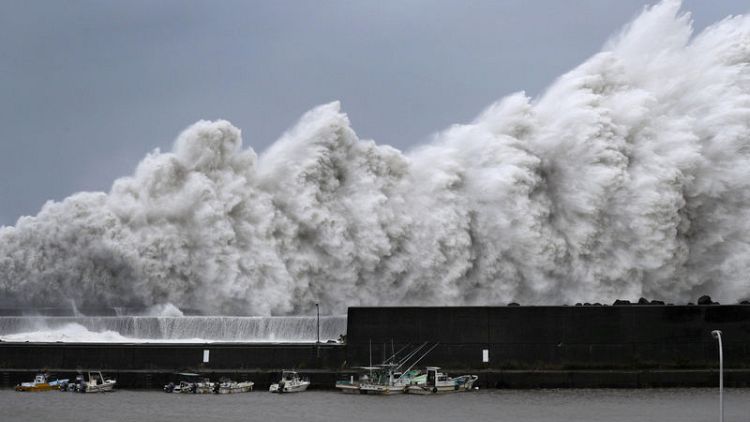 Typhoon slices through western Japan, killing at least six