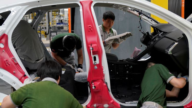 Automakers fret as China clamps down on capacity, seeks consolidation