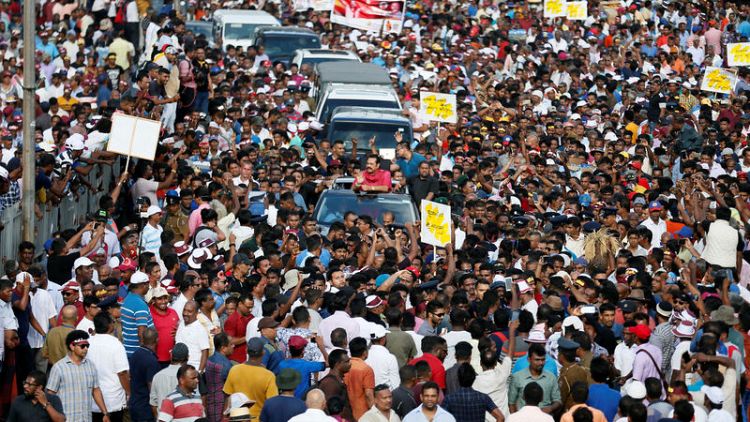 Sri Lanka opposition supporters block road over economic hardship, polls