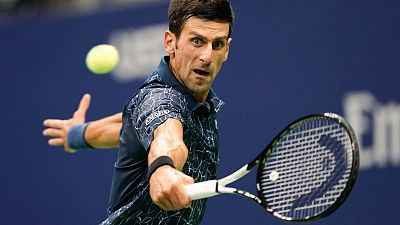 Djokovic beats heat and Millman to reach U.S. Open semis Djokovic beats heat and Millman to reach U.S. Open semis